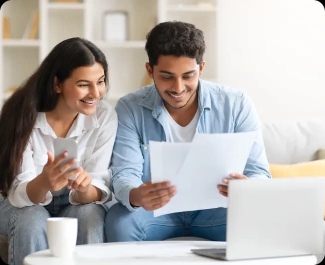 Couple reviewing financial documents
